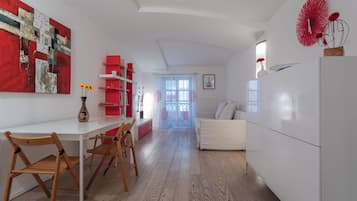 Apartment | Living area | 35-inch flat-screen TV with satellite channels