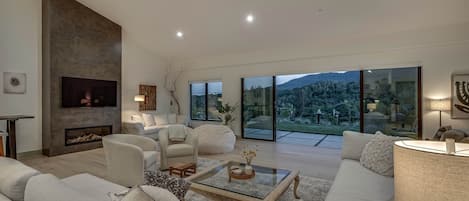 Smart TV, fireplace, books, offices