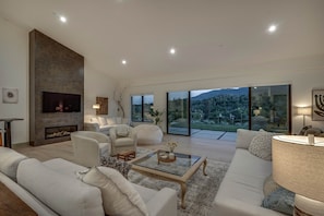 Smart TV, fireplace, books, offices