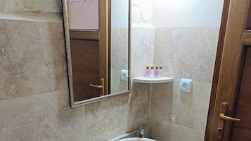 Shower, hair dryer, slippers, towels