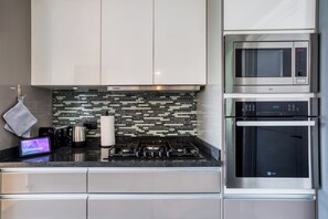 Fridge, coffee/tea maker, cookware/dishes/utensils