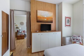 Apartment, City View | Living area | 35-inch flat-screen TV with satellite channels