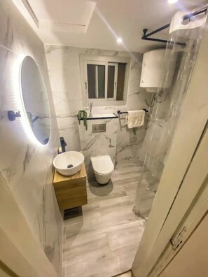 Hair dryer, towels, soap, toilet paper