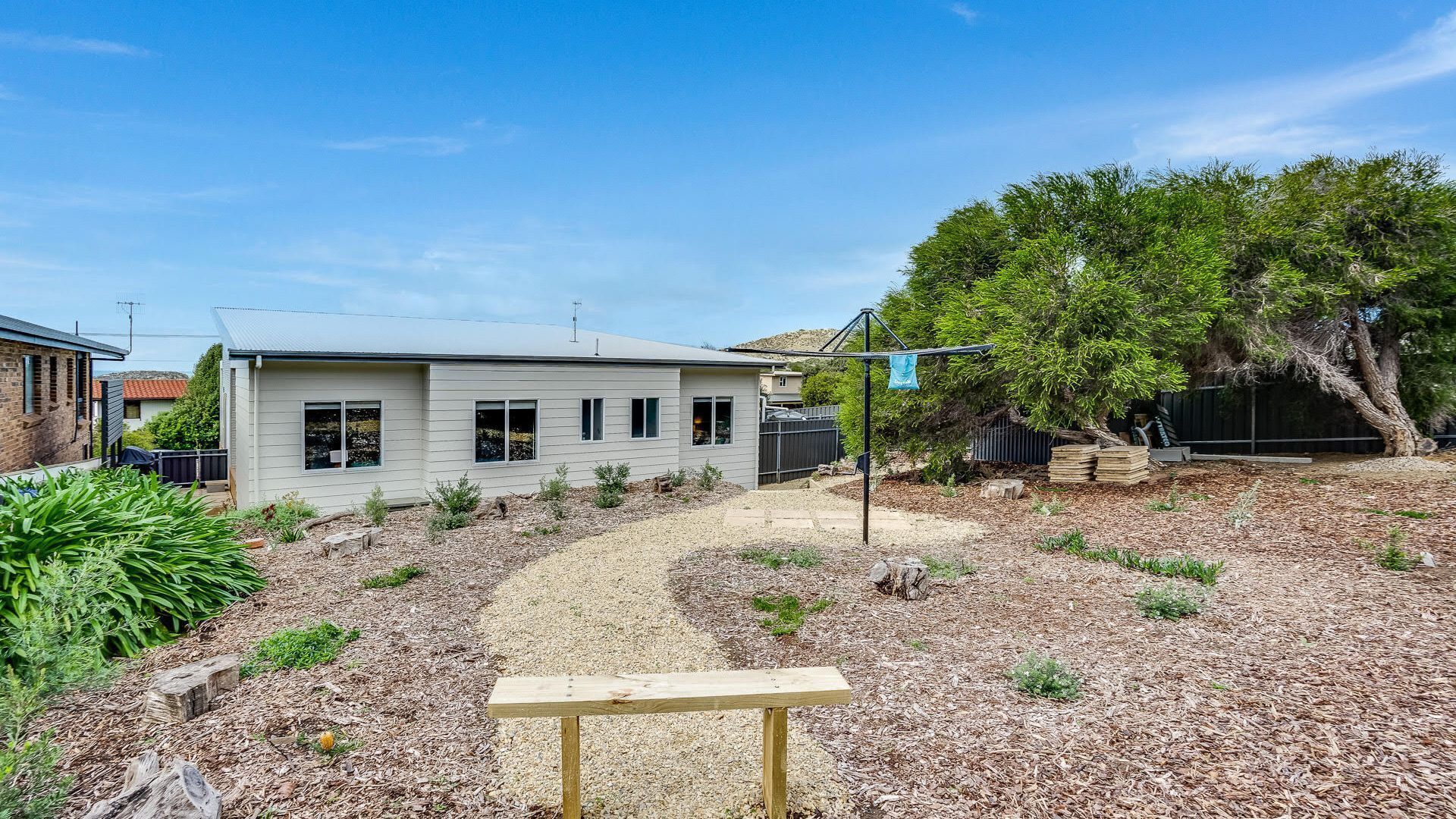 A single-story house with a front yard.
