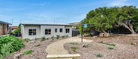 A single-story house with a front yard.