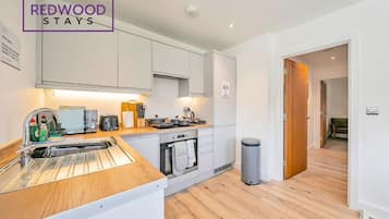 Economy Apartment, 1 Bedroom, Private Bathroom | Private kitchen | Full-sized fridge, microwave, oven, stovetop