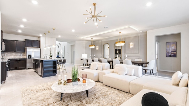 A modern kitchen with dark cabinets and a stainless steel refrigerator. - Last Minute Disney! Private Pool, Hot Tub, Game Room & Themed Bedrooms. Book Now! #111505 (Orlando)