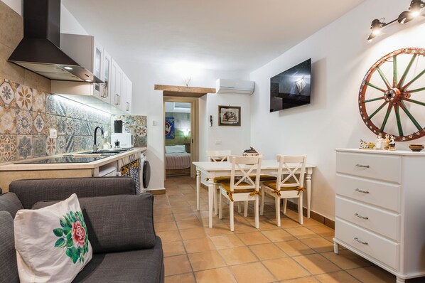 Apartment | Living area | 35-inch TV with digital channels - La casa di Rosa 1833 by Wonderful Italy (Syracuse)