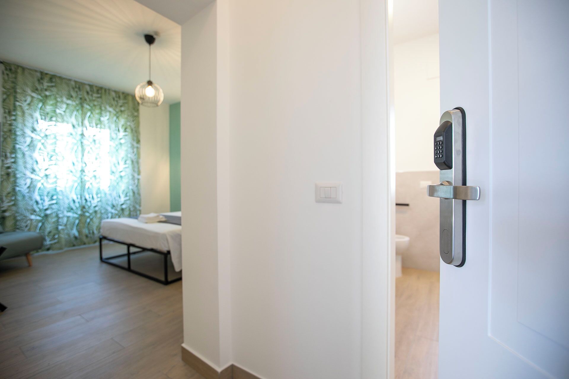 A modern bathroom with a toilet, a shower area, and a vanity.