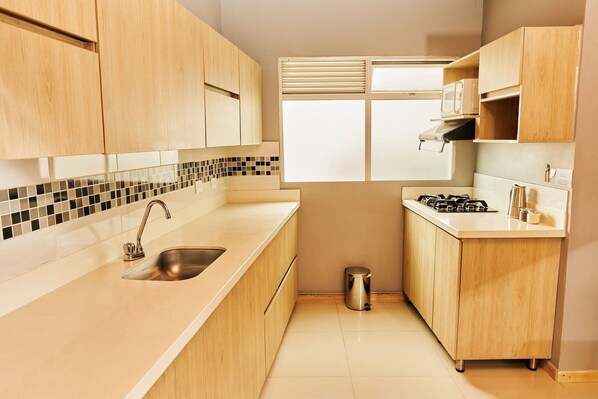 Fridge, microwave, cookware/dishes/utensils