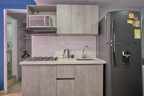 Fridge, microwave, cookware/dishes/utensils