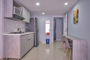 Fridge, microwave, cookware/dishes/utensils