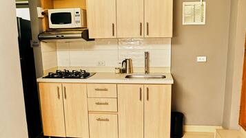 Fridge, microwave, cookware/dishes/utensils