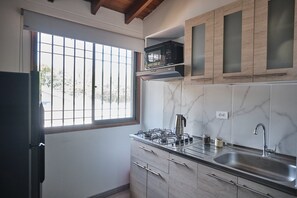 Fridge, microwave, cookware/dishes/utensils