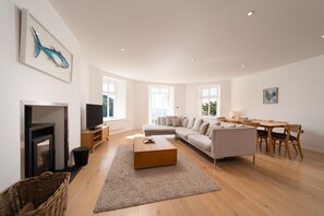 TV, fireplace - Wave View, a 3 bedroom seaside apartment in Lynmouth (Lynmouth,)