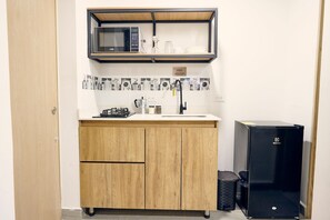 Fridge, microwave, cookware/dishes/utensils, dining tables - C108: Economic and Functional Loft (Medellín)