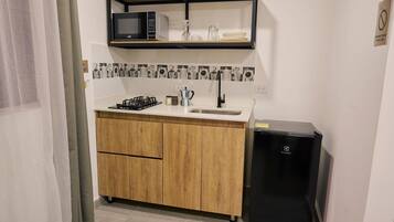 Fridge, microwave, cookware/dishes/utensils, dining tables