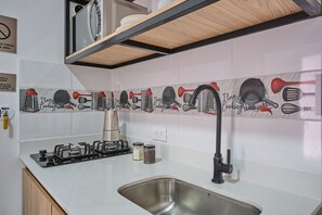 Fridge, microwave, cookware/dishes/utensils, dining tables