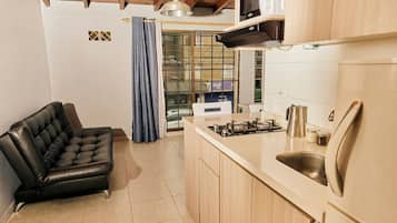 Fridge, microwave, cookware/dishes/utensils