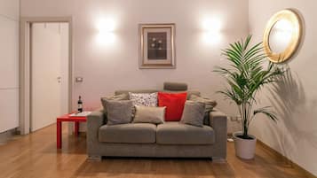 City Apartment | Living area | 37-inch flat-screen TV with digital channels