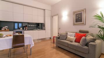 City Apartment | Living area | 37-inch flat-screen TV with digital channels