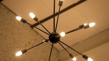 A ceiling light fixture with multiple bulbs arranged in a radial pattern.