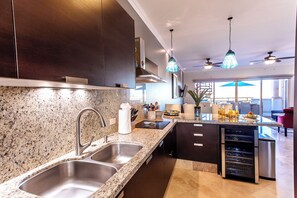 Fridge, microwave, oven, stovetop - CABO PENTHOUSE CONDO - Rooftop deck with Private Jacuzzi at Puerta Cabos Village (Cabo San Lucas)