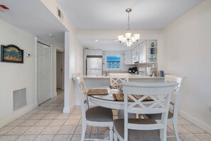 Enjoy meals in this well-appointed dining area with a round table and comfortable seating.