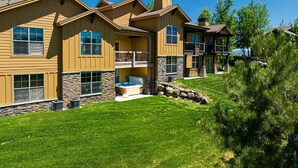 A multi-story house with a stone foundation, a hot tub, and a balcony. - Close to World-class Ski Resorts  and Summer Activities on the Lake (Heber City)
