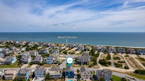 An aerial view of a coastal residential area with houses, a beach access point, and a marker indicating Coastal Camping. - Waves of Joy: Oceanside, Private Heated Pool, Hot Tub (Nags Head)