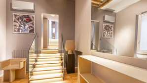 A modern interior with a staircase, wooden flooring, and minimalist decor. - Spanish Steps Rooftop Penthouse (Roma)