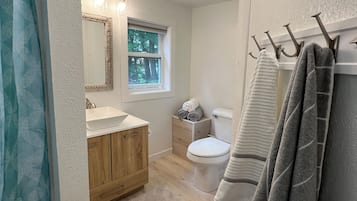 Shower, towels, soap, toilet paper