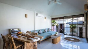 Basic Villa, Patio, Pool View | Living area | 43-inch TV with cable channels - Villa Kali Uluwatu (Pecatu)