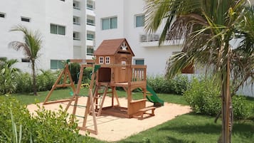 Classic Apartment, Pool View | Living area | 75-inch flat-screen TV with digital channels, pay films