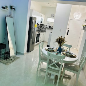 Classic Apartment, Pool View | Living area | 75-inch flat-screen TV with digital channels, pay movies