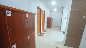 A corridor with wooden lockers labeled A3, A4, A7, and A8.
