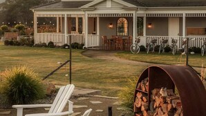 A two-story house with a porch, outdoor seating, and a fire pit. - 'Saddle Ridge' - Kangaroo Valley Private Estate (Kangaroo Valley)