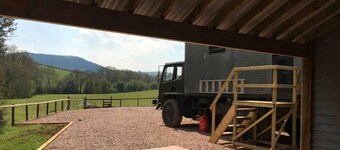 Unique stay in your very own army truck. Sleeps 4. Hot tub. Tranquil setting.