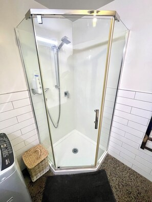 Shower, hair dryer, towels, soap