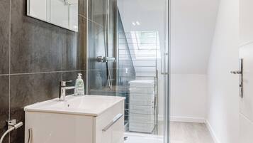 Shower, towels, soap, toilet paper