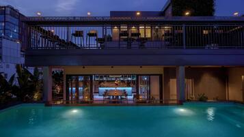 Outdoor pool, open 6:00 AM to 8:00 PM, pool loungers