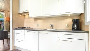 Fridge, stovetop, dishwasher, coffee/tea maker