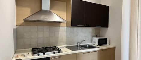 Fridge, microwave, coffee/tea maker, cookware/dishes/utensils