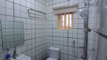 Shower, rainfall showerhead, slippers, towels