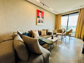 Luxury Apartment, Balcony, City View | Living area | 50-inch LED TV with digital channels, Netflix, streaming services