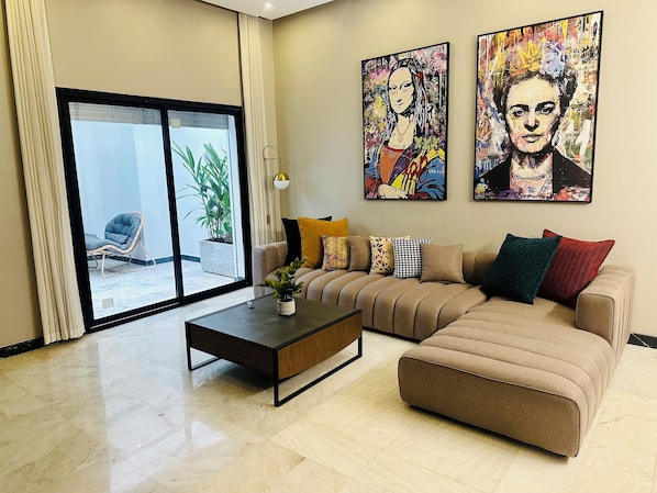 Luxury Apartment | Living area | 60-inch LED TV with satellite channels, Netflix, streaming services - Stay'Inn - Waterloo City Center (Casablanca)