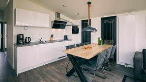 Fridge, stovetop, dishwasher, coffee/tea maker