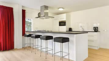 Fridge, stovetop, dishwasher, coffee/tea maker