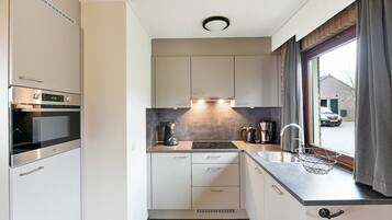 Fridge, stovetop, dishwasher, coffee/tea maker