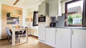 Fridge, stovetop, dishwasher, coffee/tea maker